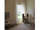 Sunlit bedroom with window and play area, featuring neutral decor at 7232 Moultrie Dr, Indianapolis, IN 46217