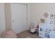Bright bedroom showcasing closet, toys, and growth chart for children at 7232 Moultrie Dr, Indianapolis, IN 46217
