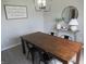 Elegant dining room with a large table, pendant lighting, and minimalist decor at 7232 Moultrie Dr, Indianapolis, IN 46217