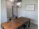 Cozy dining room featuring a rustic wooden table and industrial-style chairs at 7232 Moultrie Dr, Indianapolis, IN 46217