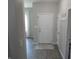 Welcoming entryway featuring a clean white door and stylish vinyl floors at 7232 Moultrie Dr, Indianapolis, IN 46217