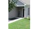 Welcoming front porch with a 'Welcome' sign, tidy landscaping, and a well-lit entrance at 7232 Moultrie Dr, Indianapolis, IN 46217