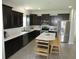 Well-appointed kitchen with stainless appliances, ample counter space and central island seating at 7232 Moultrie Dr, Indianapolis, IN 46217