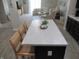 Eat-in kitchen island with seating that flows into a comfortable living area at 7232 Moultrie Dr, Indianapolis, IN 46217