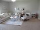 Spacious living room with a sectional sofa, accent chair, and a decorative rug at 7232 Moultrie Dr, Indianapolis, IN 46217