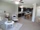 Open-concept layout connecting the living room to a modern kitchen with an island at 7232 Moultrie Dr, Indianapolis, IN 46217