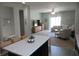 Open concept living room featuring a kitchen island flowing into a comfortable living space at 7232 Moultrie Dr, Indianapolis, IN 46217