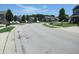 Picturesque street view showcasing well-maintained homes and manicured lawns in a friendly neighborhood at 7232 Moultrie Dr, Indianapolis, IN 46217