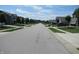 Pleasant neighborhood street view showcasing a row of homes and well-kept lawns on a sunny day at 7232 Moultrie Dr, Indianapolis, IN 46217