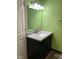 Bathroom featuring a new vanity, modern lighting, and a stylish mirror at 803 S Pershing Dr, Muncie, IN 47302