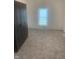 Cozy bedroom with large window, new carpeting, and ample closet space at 803 S Pershing Dr, Muncie, IN 47302