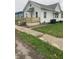 A charming home with a freshly painted exterior and a cozy new front porch at 803 S Pershing Dr, Muncie, IN 47302