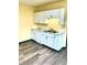 Updated kitchen with stylish white cabinets, modern countertops, and new flooring at 803 S Pershing Dr, Muncie, IN 47302