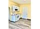 Efficient kitchen with modern appliances, white cabinetry, and fresh flooring at 803 S Pershing Dr, Muncie, IN 47302