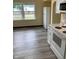 Bright kitchen featuring new floors, modern appliances, and ample counter space at 803 S Pershing Dr, Muncie, IN 47302