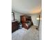 Bedroom featuring carpet, dresser, lamp, and a wooden bunk bed at 8323 Lake Tree Ln, Indianapolis, IN 46217