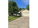 Charming single-story home with a well-maintained lawn, concrete driveway, and an attached two-car garage at 8323 Lake Tree Ln, Indianapolis, IN 46217