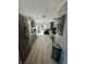 Galley kitchen featuring sleek appliances, stylish cabinets, and tile floors at 8323 Lake Tree Ln, Indianapolis, IN 46217