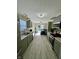 Well-lit kitchen featuring sleek appliances, modern cabinetry, and light-colored tiled floors at 8323 Lake Tree Ln, Indianapolis, IN 46217