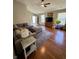 Inviting living room with hardwood floors, a comfortable sofa, and plenty of natural light at 8323 Lake Tree Ln, Indianapolis, IN 46217
