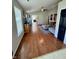 Hardwood floors accent this living room with vaulted ceilings, neutral walls, and natural light at 8323 Lake Tree Ln, Indianapolis, IN 46217