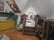 Stylish attic living room area with wooden stairs and unique wall decor at 8423 Mud Creek Rd, Indianapolis, IN 46256