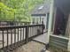 Outdoor deck with railing, greenery, and a partial view of the house at 8423 Mud Creek Rd, Indianapolis, IN 46256