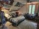 Slanted ceiling bedroom with a queen sized bed, large window, and carpeted floor at 8423 Mud Creek Rd, Indianapolis, IN 46256