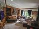 Elegant living room with built-in bookshelves, fireplace, and comfortable seating at 8423 Mud Creek Rd, Indianapolis, IN 46256