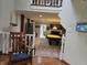 Open living room showcases a pool table, fireplace, and abundant natural light at 8423 Mud Creek Rd, Indianapolis, IN 46256
