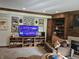 Cozy living room featuring built-in shelves, a modern TV, and carpet at 8423 Mud Creek Rd, Indianapolis, IN 46256