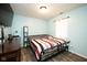 Relaxing bedroom featuring hardwood floors, closet, and natural light from the window at 8514 Midsummer Dr, Indianapolis, IN 46239