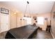 Spacious game room featuring a covered pool table and ample lighting for entertainment at 8514 Midsummer Dr, Indianapolis, IN 46239