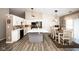 Bright kitchen features white cabinets, black appliances, a large island, and an adjacent dining area at 8514 Midsummer Dr, Indianapolis, IN 46239