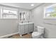 Bright bathroom featuring a double vanity, toilet, and modern fixtures for a comfortable and stylish experience at 920 State St, Shelbyville, IN 46176
