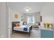 Bright bedroom with window seat, stylish lighting, and playful decor at 920 State St, Shelbyville, IN 46176