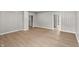 Open living room featuring hardwood floors, neutral walls, and white trim throughout the space at 920 State St, Shelbyville, IN 46176