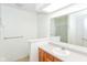 Bathroom featuring a large mirror, vanity, sink, and walk-in shower at 9552 Maple Way, Indianapolis, IN 46268