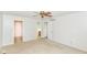 Neutral bedroom showcasing beige carpet and multiple doorways to other rooms at 9552 Maple Way, Indianapolis, IN 46268