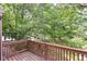 Spacious deck offers peaceful views of the surrounding greenery, enhancing the outdoor experience at 9552 Maple Way, Indianapolis, IN 46268