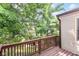 View from the deck showcases lush greenery, providing a serene and private outdoor living space at 9552 Maple Way, Indianapolis, IN 46268