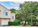 Charming exterior of this home featuring a well-maintained lawn, mature trees, and an attached garage at 9552 Maple Way, Indianapolis, IN 46268