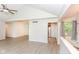 Open-concept living space with vaulted ceilings, neutral paint, and modern flooring for versatile living at 9552 Maple Way, Indianapolis, IN 46268