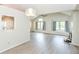 Bright living room with vaulted ceilings, wood-look floors, and a fireplace at 9552 Maple Way, Indianapolis, IN 46268
