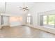 Open living area boasts natural light, modern floors, vaulted ceilings, and an inviting atmosphere at 9552 Maple Way, Indianapolis, IN 46268