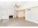 Spacious living area with a cozy fireplace, neutral walls, and modern flooring, perfect for entertaining at 9552 Maple Way, Indianapolis, IN 46268