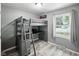 Functional bedroom features a unique bunk bed and desk, maximizing space and style at 1039 Eastlawn Dr, Whiteland, IN 46184