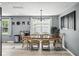 Inviting dining room with an oval table, six chairs, and elegant lighting fixtures at 1039 Eastlawn Dr, Whiteland, IN 46184