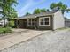 Charming ranch home with stone accents, a welcoming front porch, and a gravel driveway at 1039 Eastlawn Dr, Whiteland, IN 46184