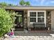 Inviting front porch with seating, decorative elements, and a view of the home's address at 1039 Eastlawn Dr, Whiteland, IN 46184